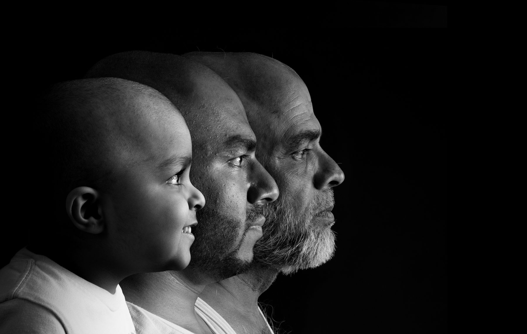 Three generations in profile, black and white